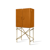 Designer leather wine cabinet with elegant golden cross-frame base, offering stylish wine and glassware storage.